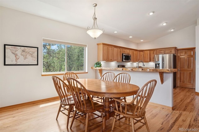 29004 Amerind Springs Trl, Pine, CO 80470 - dining space featuring light wood finished floors, recessed lighting, and vaulted ceiling