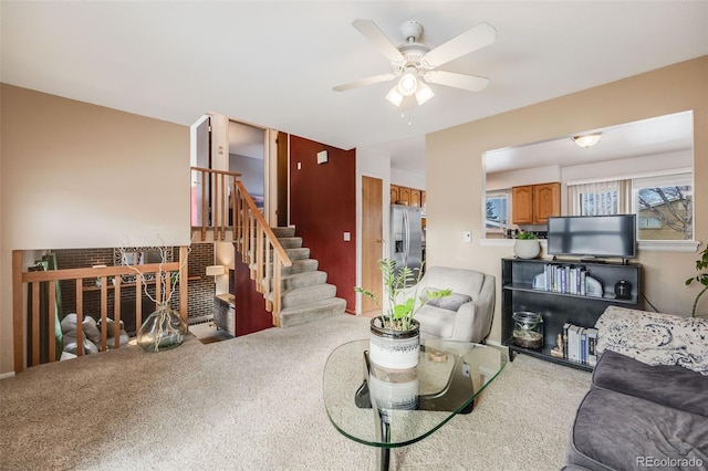 carpeted living room featuring ceiling fan