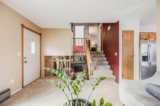 carpeted living room with baseboard heating