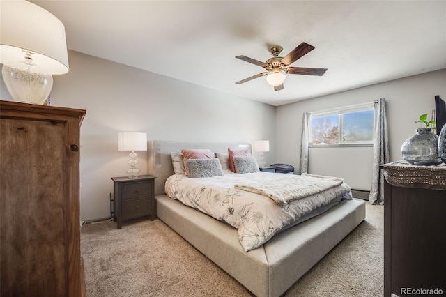 bedroom with light colored carpet, ceiling fan, and baseboard heating