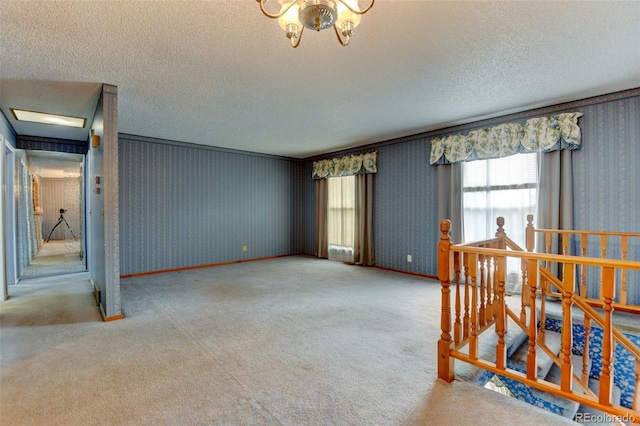 9766 Fillmore St, Thornton, CO 80229 - carpeted spare room featuring a textured ceiling and a chandelier