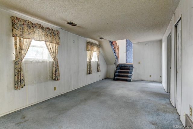 9766 Fillmore St, Thornton, CO 80229 - carpeted spare room with a textured ceiling and stairway