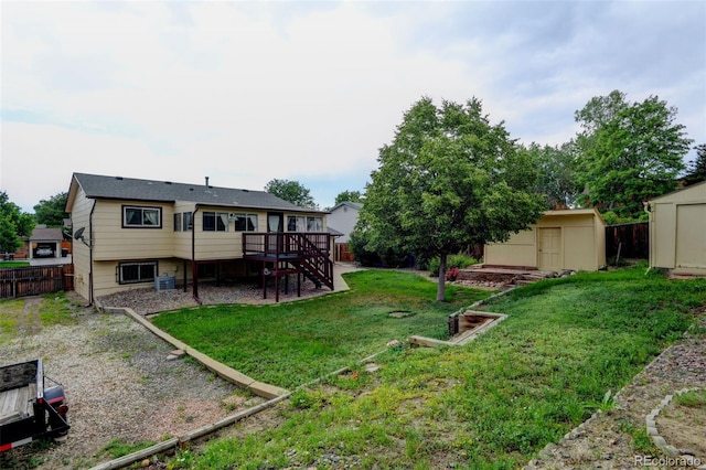 9766 Fillmore St, Thornton, CO 80229 - fenced backyard featuring a storage unit, stairway, and a wooden deck