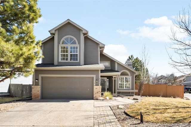 view of front of property featuring concrete driveway, an attached garage, fence, and brick siding