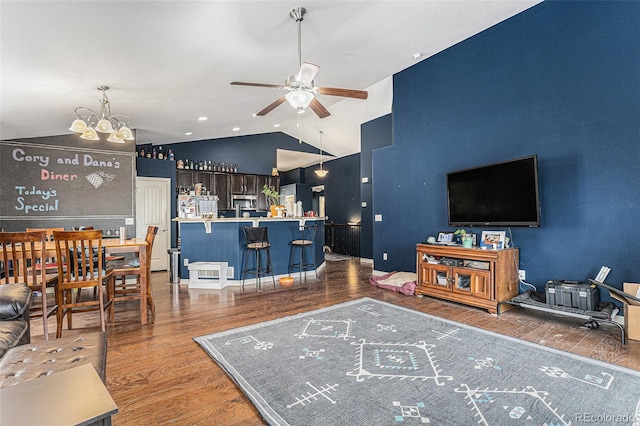 6817 Sequoia St, Frederick, CO 80530 - living area with vaulted ceiling, wood finished floors, and ceiling fan with notable chandelier