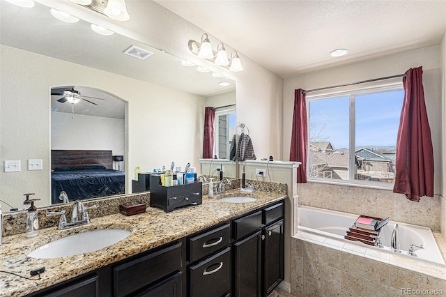 6817 Sequoia St, Frederick, CO 80530 - full bath with a sink, ceiling fan, connected bathroom, and visible vents