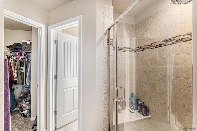 6817 Sequoia St, Frederick, CO 80530 - bathroom featuring a walk in closet and a stall shower