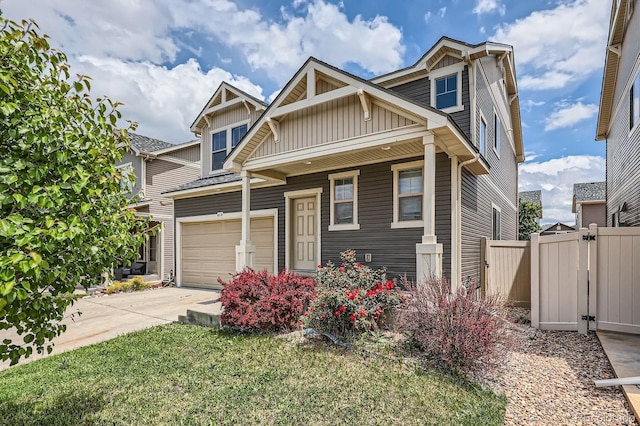 4414 Walden St, Denver, CO 80249 - craftsman-style house with board and batten siding, a garage, concrete driveway, a gate, and a porch
