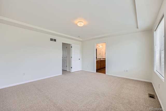 4414 Walden St, Denver, CO 80249 - unfurnished bedroom featuring light colored carpet, multiple windows, and ensuite bathroom