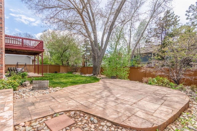 view of patio / terrace with a fenced backyard and a wooden deck