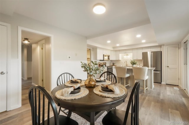 404 Raspberry Ln, Monument, CO 80132 - dining room featuring light wood-type flooring and recessed lighting