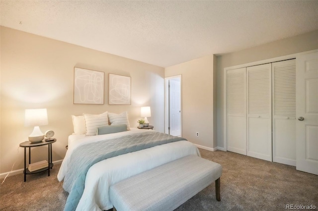 404 Raspberry Ln, Monument, CO 80132 - bedroom featuring carpet, a closet, baseboards, and a textured ceiling