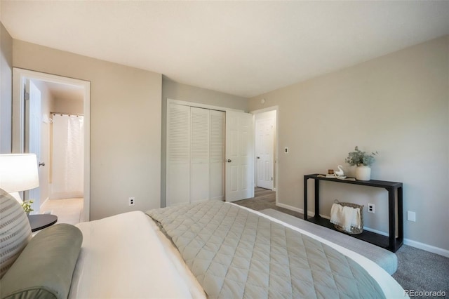 404 Raspberry Ln, Monument, CO 80132 - carpeted bedroom featuring baseboards, a closet, and ensuite bathroom