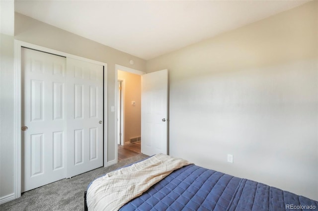 404 Raspberry Ln, Monument, CO 80132 - bedroom featuring carpet floors, a closet, and baseboards