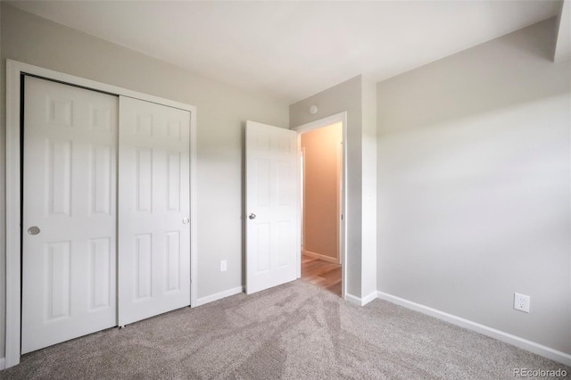 404 Raspberry Ln, Monument, CO 80132 - unfurnished bedroom with carpet flooring, baseboards, and a closet