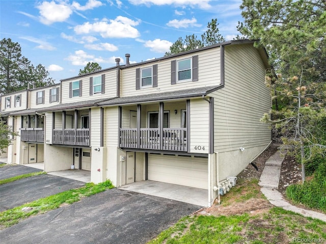 404 Raspberry Ln, Monument, CO 80132 - view of property with an attached garage and asphalt driveway
