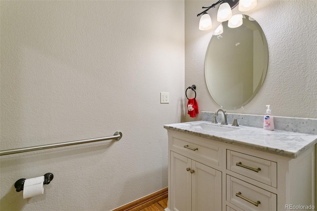 bathroom featuring vanity and hardwood / wood-style floors