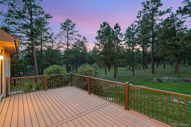 deck at dusk with a lawn