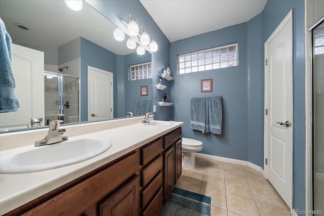 12856 King St, Broomfield, CO 80020 - full bathroom featuring a shower stall, double vanity, and tile patterned floors