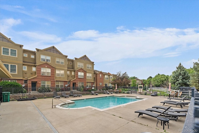 12856 King St, Broomfield, CO 80020 - community pool with a patio area and a residential view