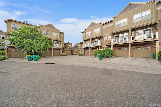 12856 King St, Broomfield, CO 80020 - townhome / multi-family property with a residential view, a garage, and driveway