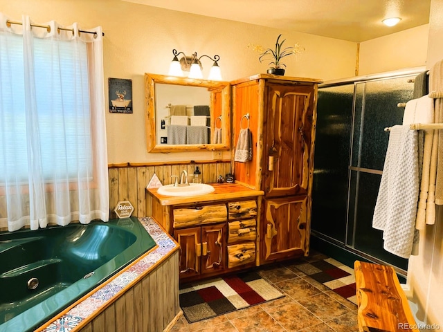 bathroom with vanity, plus walk in shower, and tile patterned flooring