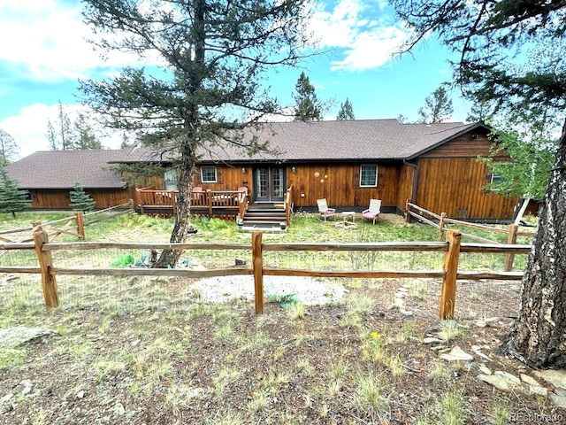 view of front of house featuring a wooden deck