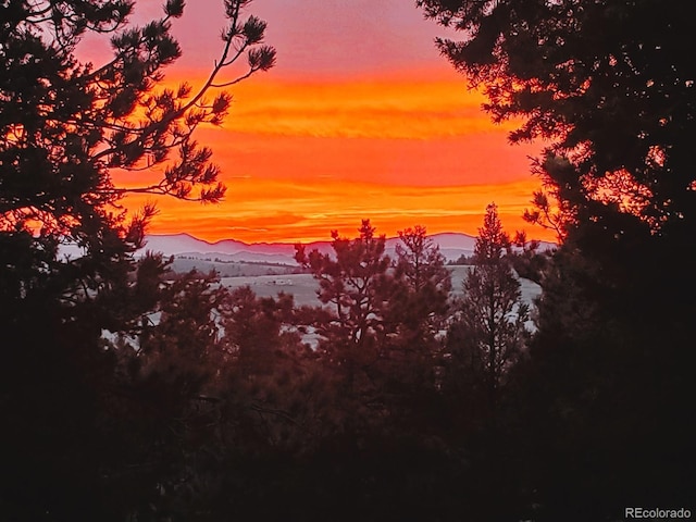 nature at dusk featuring a mountain view