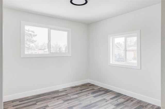 spare room with light wood-type flooring