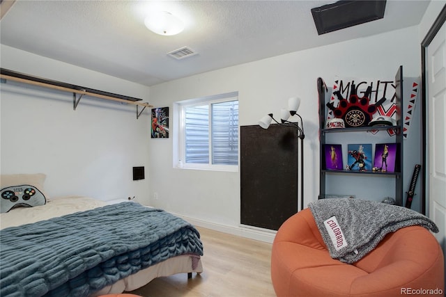 bedroom featuring light hardwood / wood-style floors