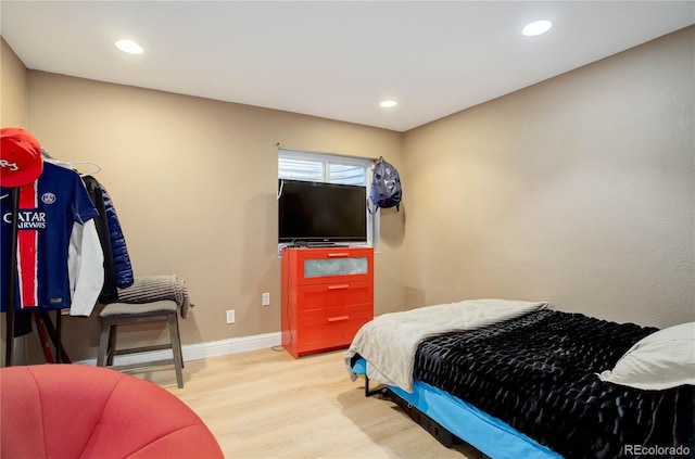 bedroom with wood-type flooring