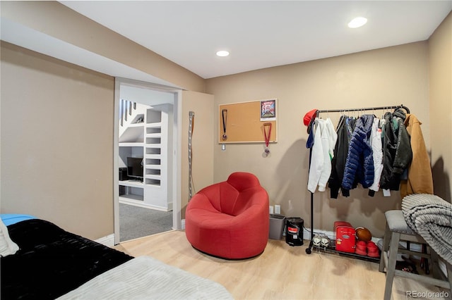 bedroom with wood-type flooring