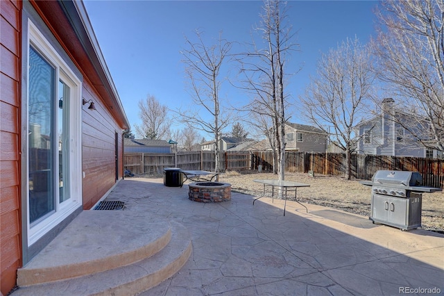 view of patio with a fire pit and grilling area