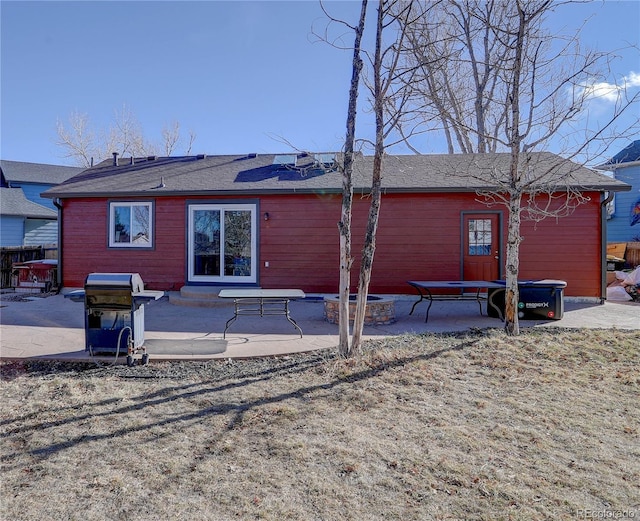 rear view of house with a patio