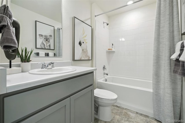 full bath featuring shower / bath combination with curtain, vanity, and toilet