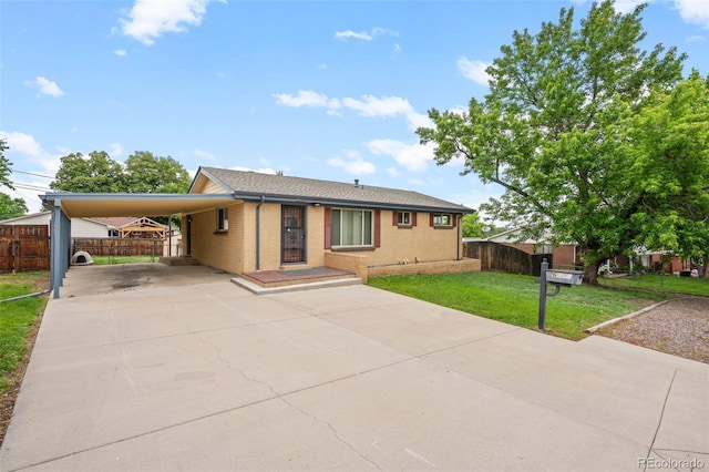 6627 Eaton St, Arvada, CO 80003 - view of front of home with concrete driveway, a carport, and brick siding