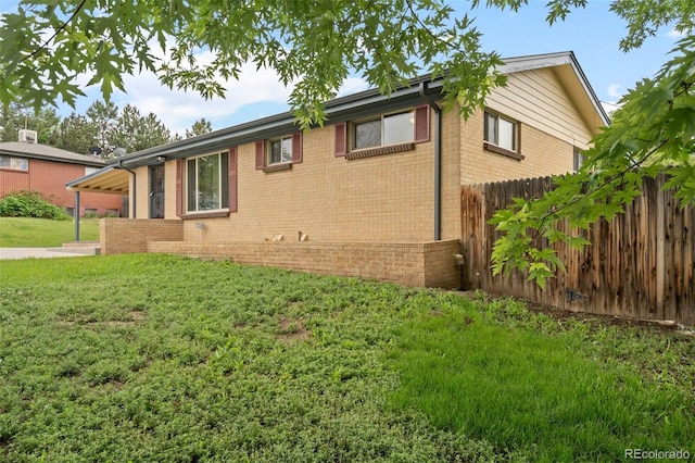 6627 Eaton St, Arvada, CO 80003 - view of side of home with brick siding