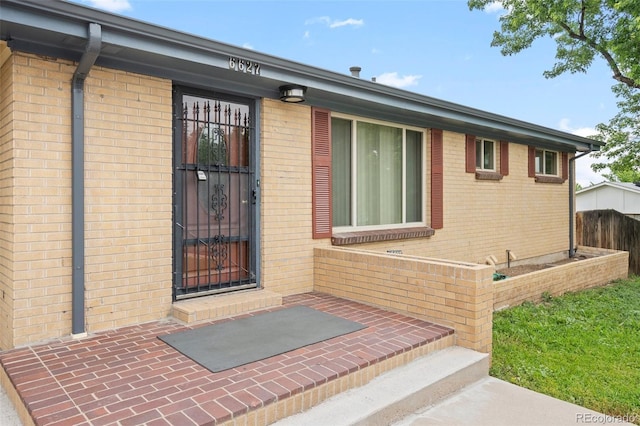 6627 Eaton St, Arvada, CO 80003 - view of exterior entry with brick siding