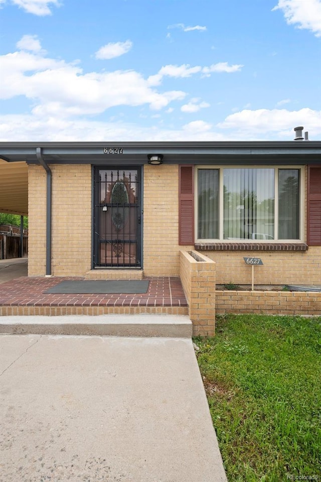 6627 Eaton St, Arvada, CO 80003 - entrance to property with brick siding