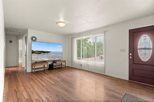 6627 Eaton St, Arvada, CO 80003 - entrance foyer with wood finished floors and baseboards