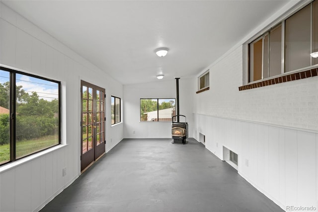 6627 Eaton St, Arvada, CO 80003 - unfurnished sunroom featuring a wood stove and french doors