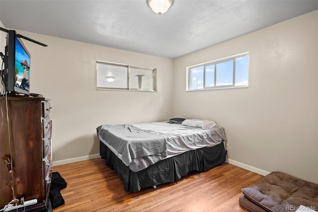 6627 Eaton St, Arvada, CO 80003 - bedroom with wood finished floors and baseboards
