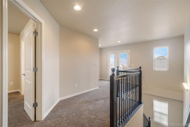 hall with carpet floors