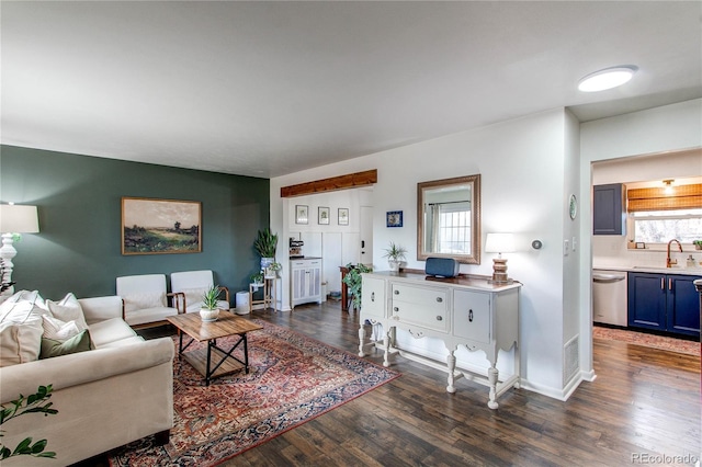 living room featuring dark wood finished floors and baseboards