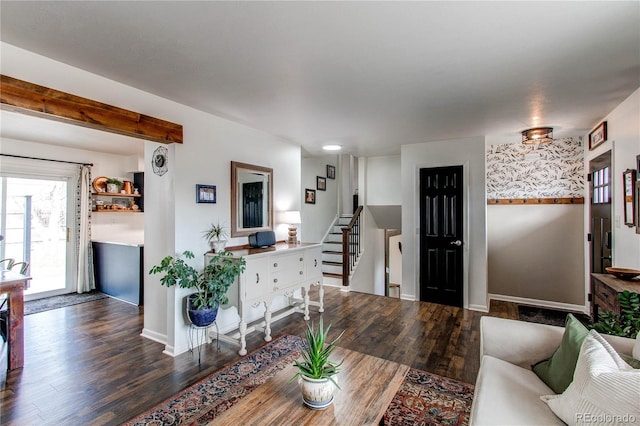 living room with baseboards, stairway, and wood finished floors