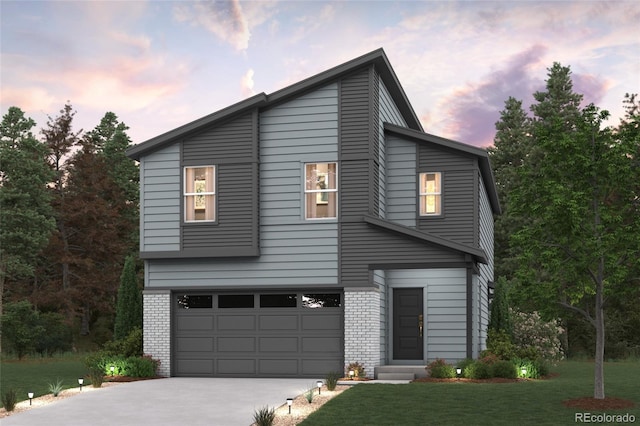 view of front of property with a garage and a lawn