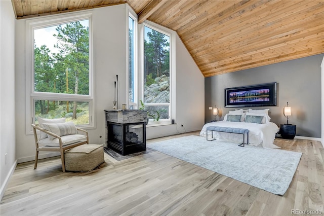 bedroom with lofted ceiling, wood finished floors, and wood ceiling