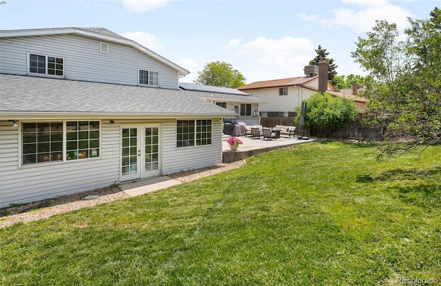 7371 Otis Ct, Arvada, CO 80003 - back of property featuring french doors, a patio, an outdoor living space, and roof with shingles