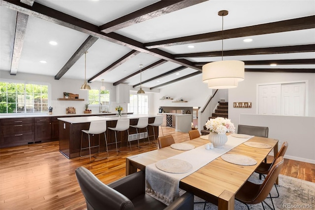 7371 Otis Ct, Arvada, CO 80003 - dining space with plenty of natural light, stairs, light wood-style flooring, and recessed lighting