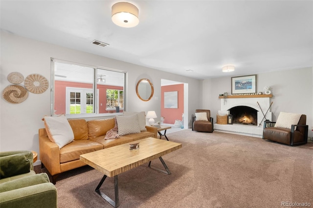 7371 Otis Ct, Arvada, CO 80003 - living area with carpet floors and a lit fireplace